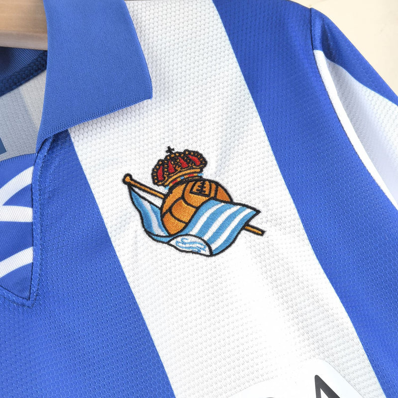 Camisa Real Sociedad 24/25 Macron - Branco e Azul